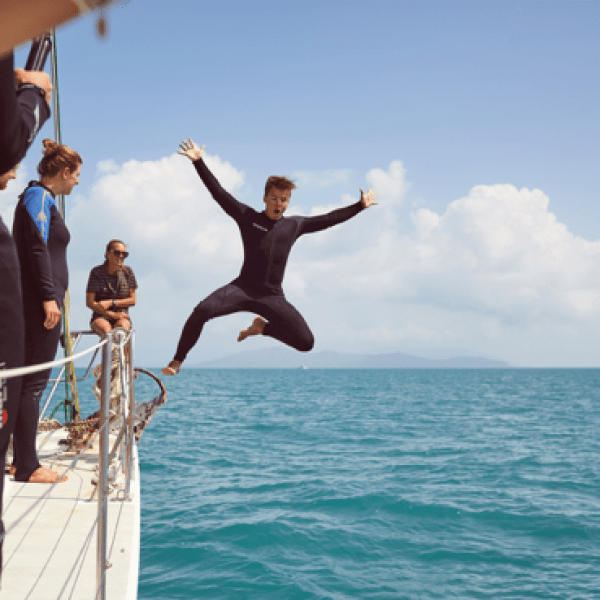 a couple of people that are standing in the water
